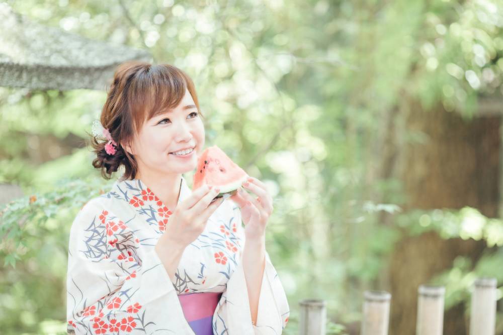 a woman having watermelon